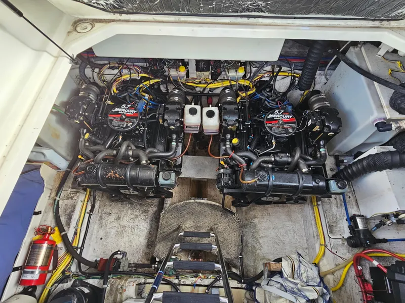 Slide: The Image of 2006 Bayliner 325 engine compartment with twin MerCruiser engines. - 13