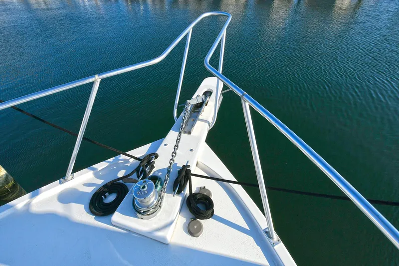 Slide: The Image of Bow of 2000 Torres 48 Enclosed Bridge yacht with anchor and railing. - 14