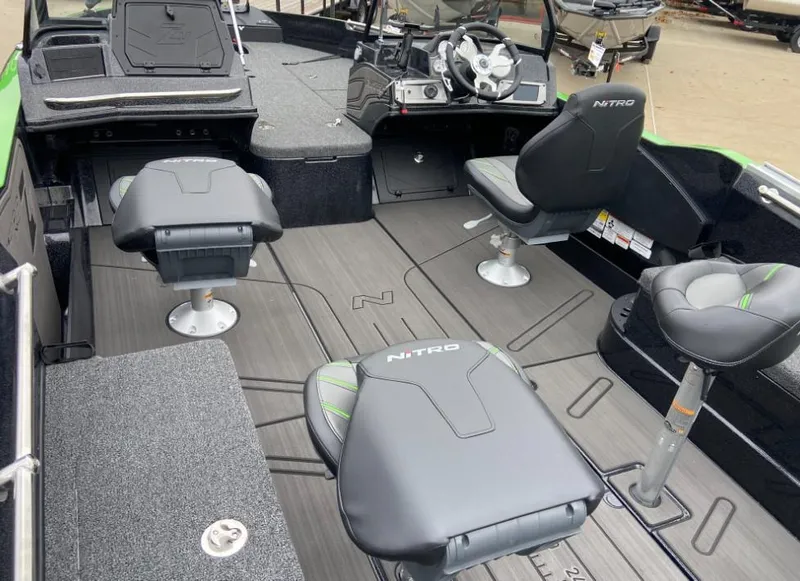 Slide: The Image of 2024 Nitro ZV21 fishing boat interior with seating and steering console. - 4