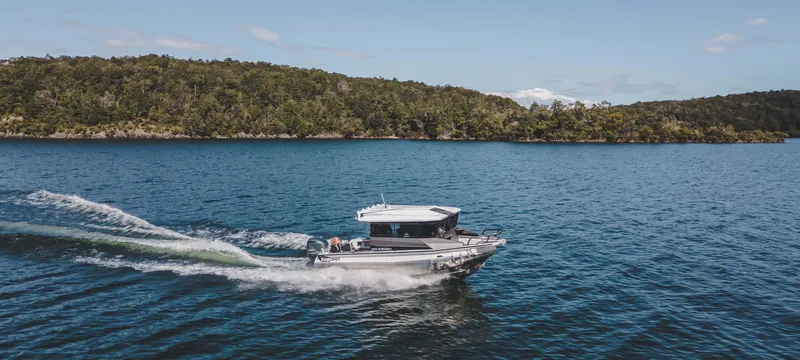 Slide: The Image of 2023 Stabicraft 2250 UltraCab WT cruising on a scenic lake. - 11