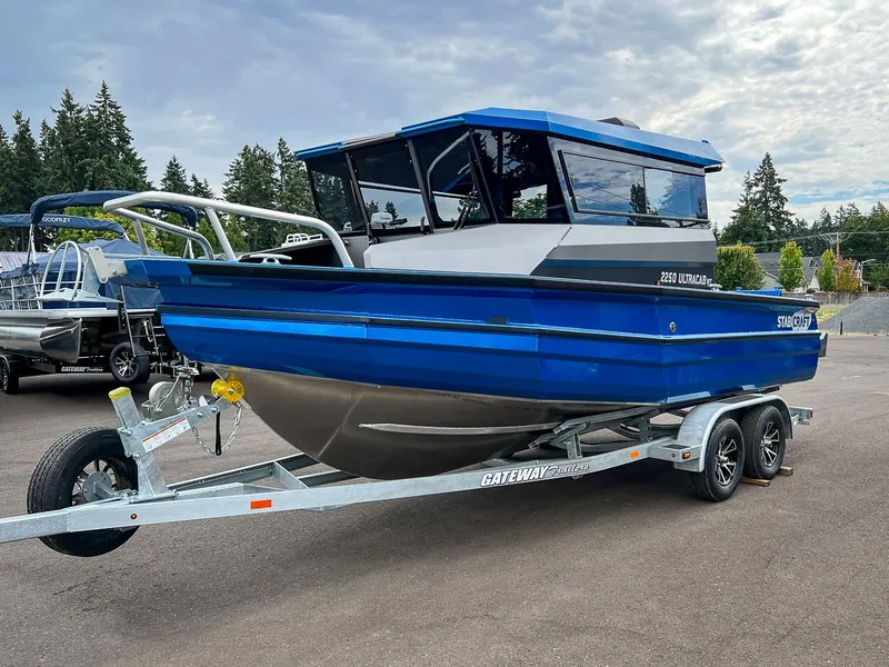 Slide: The Image of 2023 Stabicraft 2250 UltraCab WT boat on a trailer in a parking lot. - 6