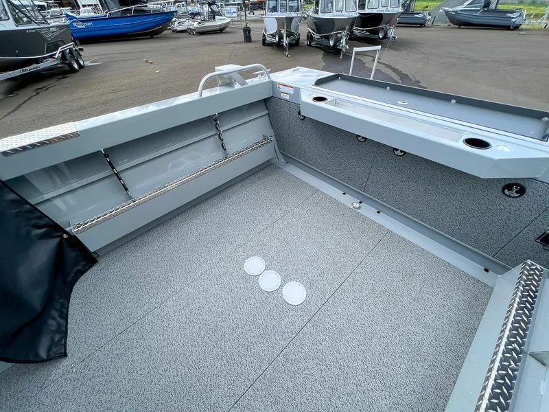 Slide: The Image of 2023 Hewescraft 200 Pro-V ET boat interior, spacious deck, and storage compartments. - 15