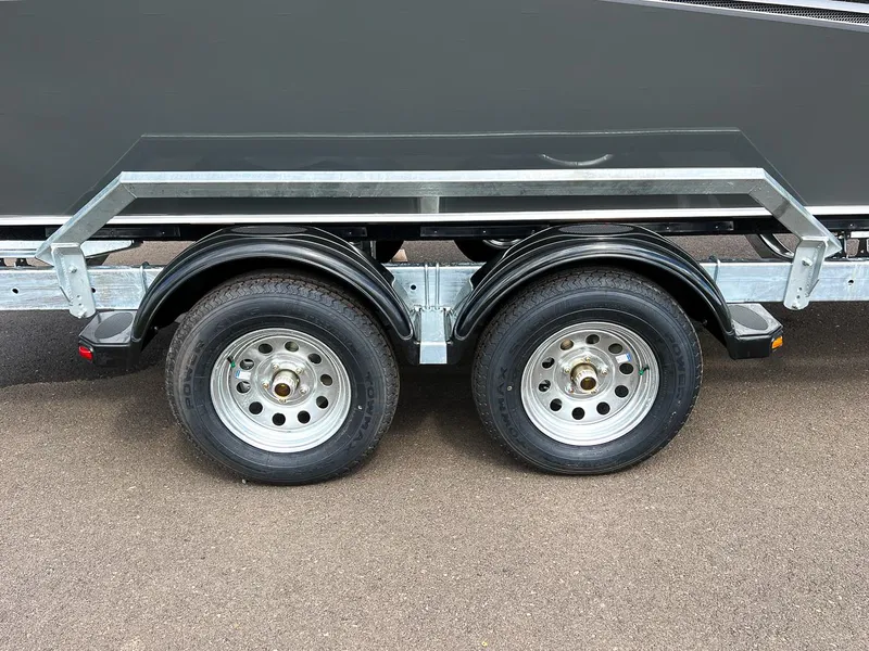 Slide: The Image of 2023 Hewescraft 200 Pro-V ET trailer with dual axles and black fenders. - 20