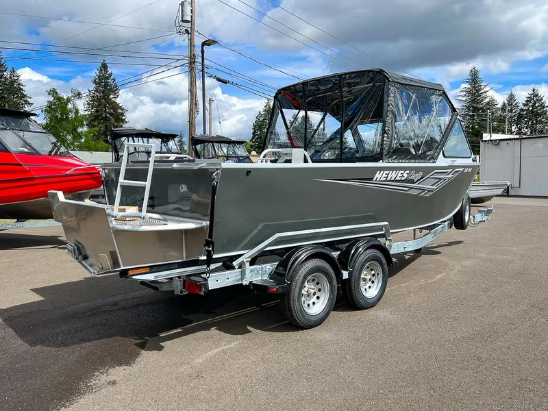 Slide: The Image of 2023 Hewescraft 200 Pro-V ET boat on a trailer, outdoor display. - 3