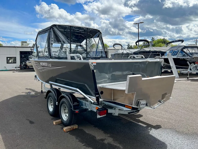 Slide: The Image of 2023 Hewescraft 200 Pro-V ET boat on trailer under a cloudy sky. - 5