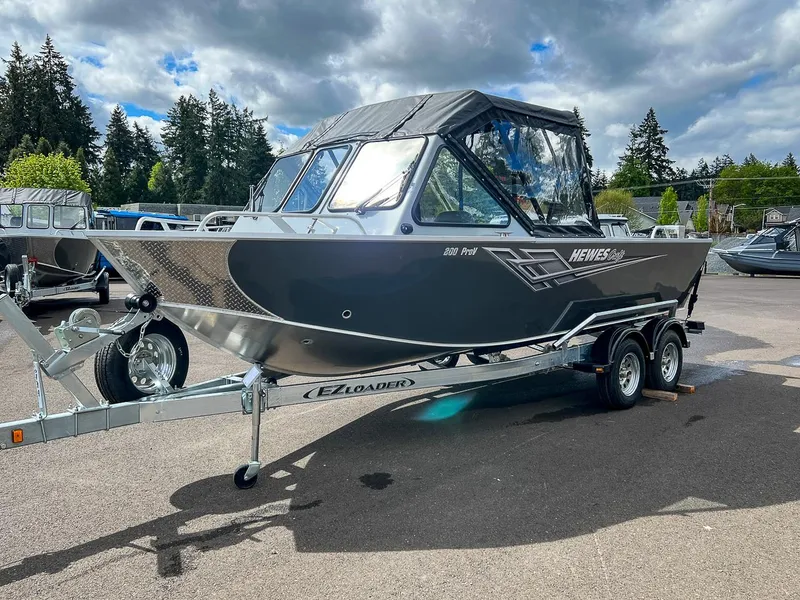 Slide: The Image of 2023 Hewescraft 200 Pro-V ET boat on EZ Loader trailer in outdoor setting. - 6