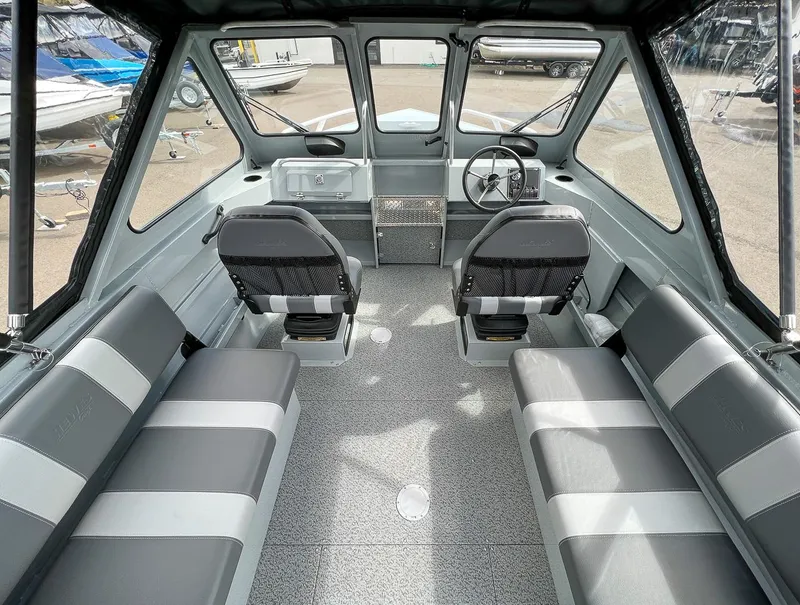 Slide: The Image of 2023 Hewescraft 200 Pro-V ET interior with seating and steering console. - 7
