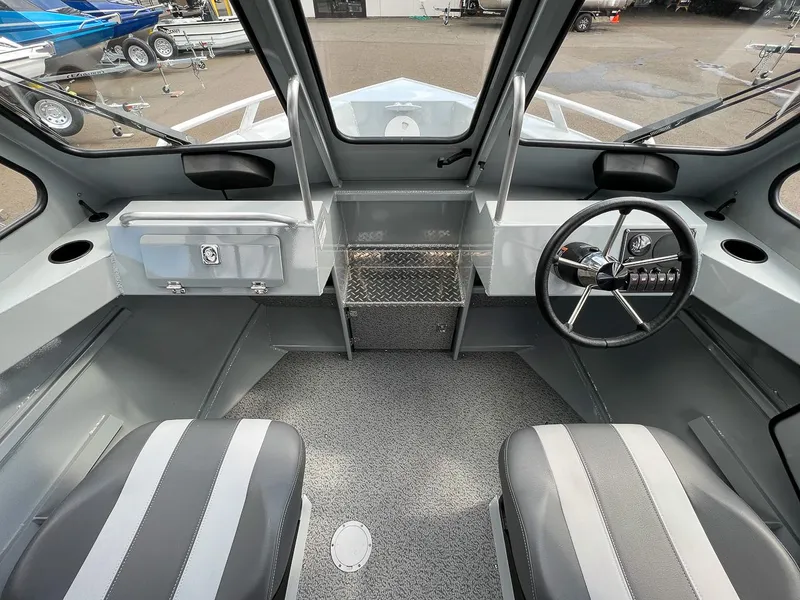 Slide: The Image of 2023 Hewescraft 200 Pro-V ET boat interior with steering wheel and seating - 9
