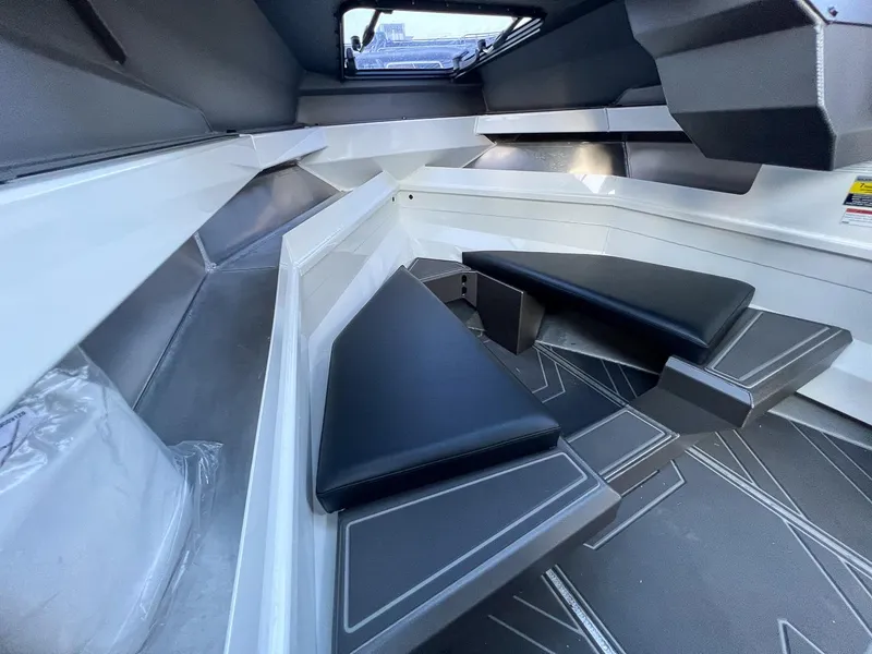 Slide: The Image of Interior of 2025 Stabicraft 2050 Supercab with black cushioned seating. - 11