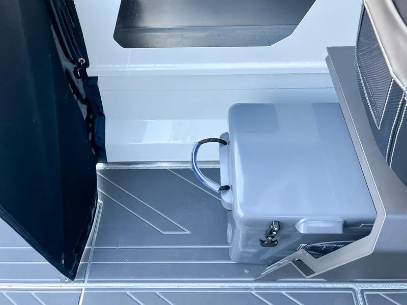 Slide: The Image of Interior of 2025 Stabicraft 2050 Supercab showing storage compartment and cooler. - 15