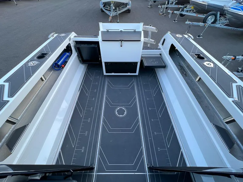 Slide: The Image of 2025 Stabicraft 2050 Supercab interior view with spacious deck and storage compartments. - 17