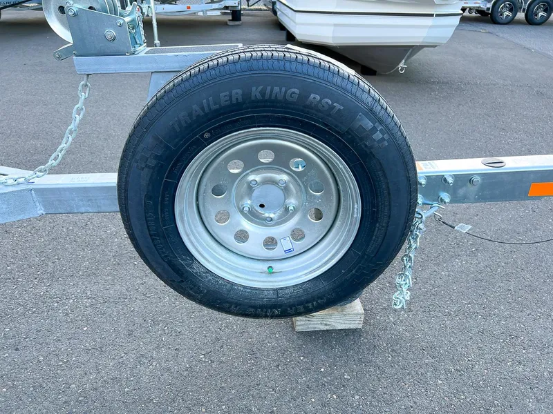 Slide: The Image of Trailer wheel of a 2025 Stabicraft 2050 Supercab boat on a trailer. - 20