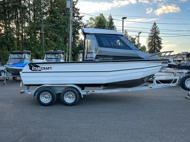 Slide: The Image of 2025 Stabicraft 2050 Supercab boat on a trailer in a parking lot. - 3