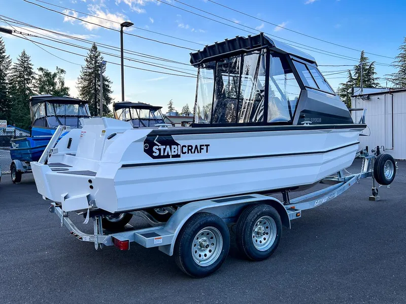 Slide: The Image of 2025 Stabicraft 2050 Supercab boat on a trailer in a parking lot. - 4