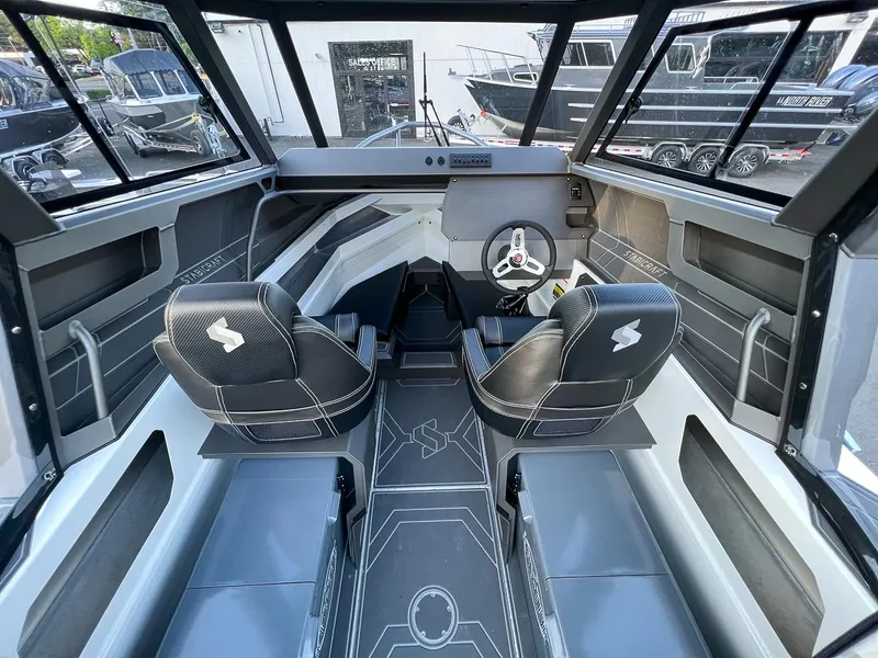 Slide: The Image of Interior of 2025 Stabicraft 2050 Supercab boat with modern seating and steering console. - 9