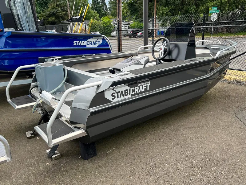 Slide: The Image of 2025 Stabicraft 1450 Frontier boat on display, featuring a sleek design and sturdy build. - 3