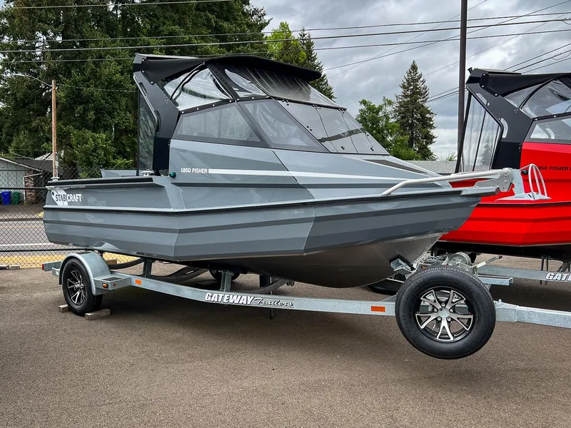 Slide: The Image of 2023 Stabicraft 1850 Fisher boat on a trailer, gray color, outdoor display. - 1