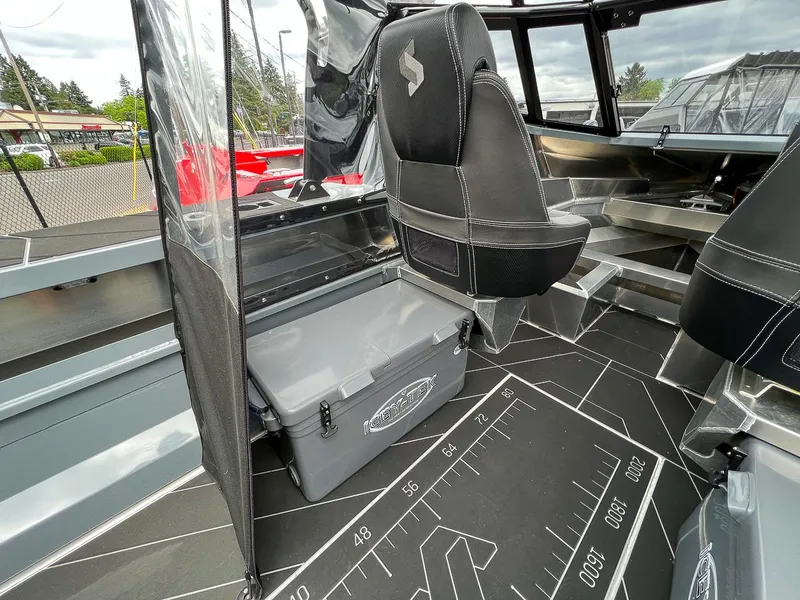 Slide: The Image of 2023 Stabicraft 1850 Fisher interior with seating and storage compartments. - 11