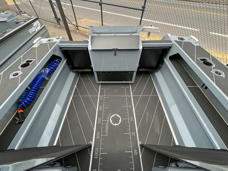 Slide: The Image of 2023 Stabicraft 1850 Fisher boat interior with storage compartments and measuring mat. - 13