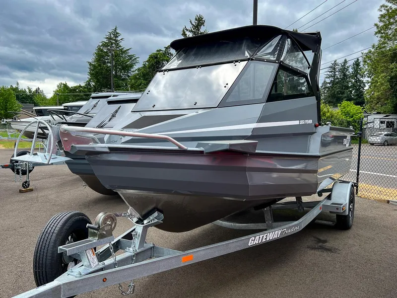Slide: The Image of 2023 Stabicraft 1850 Fisher boat on a Gateway trailer in a parking lot. - 6