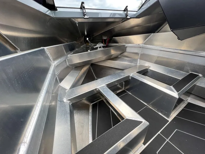 Slide: The Image of Interior view of 2023 Stabicraft 1850 Fisher boat, showcasing aluminum construction and seating layout. - 9