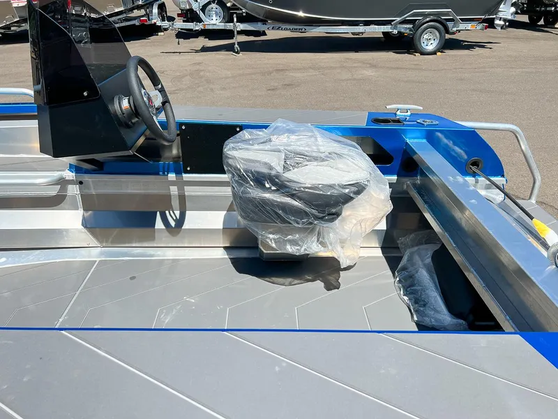 Slide: The Image of 2023 Stabicraft 1450 Frontier boat interior with steering console and wrapped seat. - 9