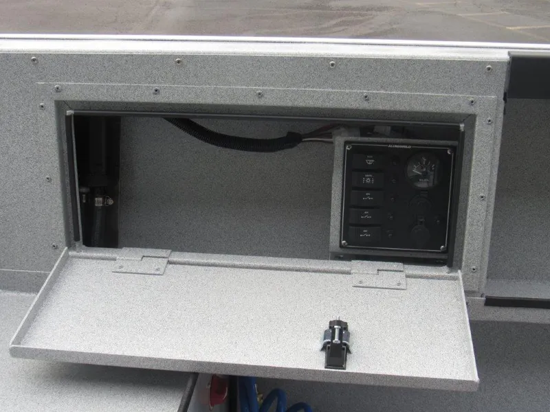 Slide: The Image of Control panel of 2024 Alumaweld 20 ADVENTURER boat with open compartment. - 12