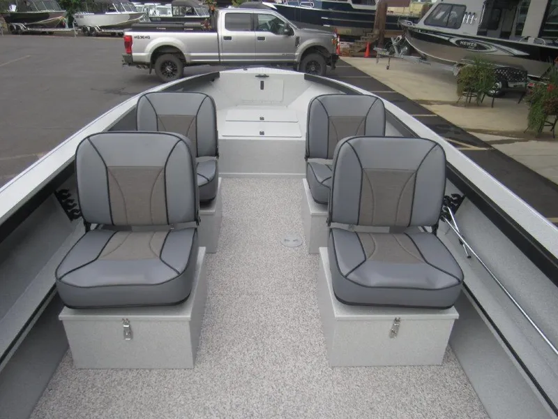 Slide: The Image of 2024 Alumaweld 20 ADVENTURER boat interior with four gray seats and storage compartments. - 13