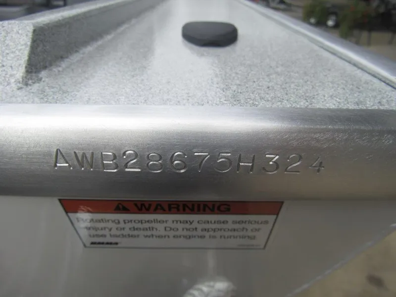 Slide: The Image of 2024 Alumaweld 20 Adventurer boat hull identification number and warning label. - 16