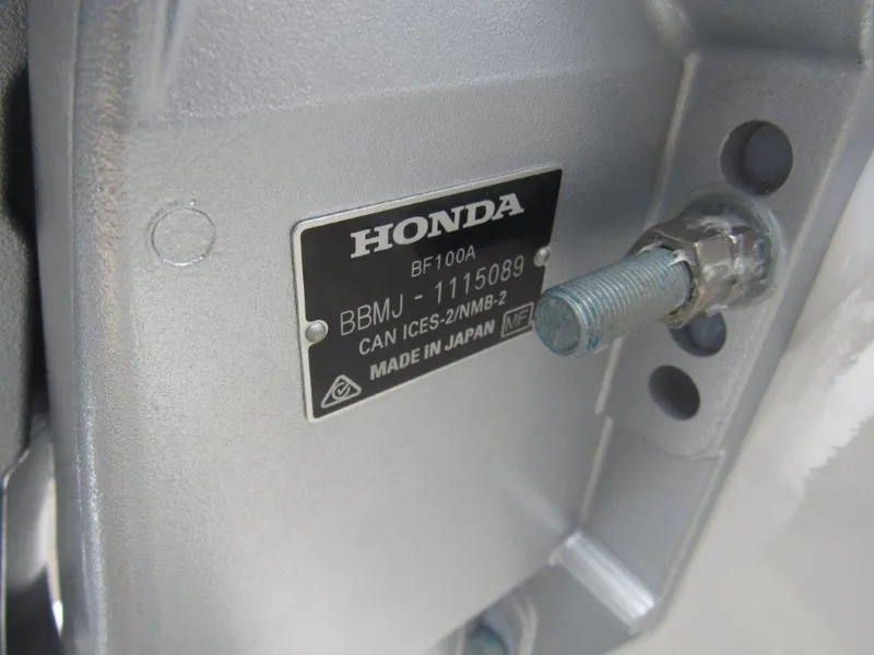 Slide: The Image of Close-up of Honda BF100A engine part on 2024 Alumaweld 20 Adventurer boat. - 18