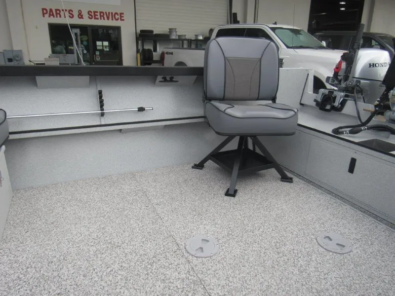 Slide: The Image of 2024 Alumaweld 20 Adventurer boat interior with swivel seat and fishing rod holder. - 9