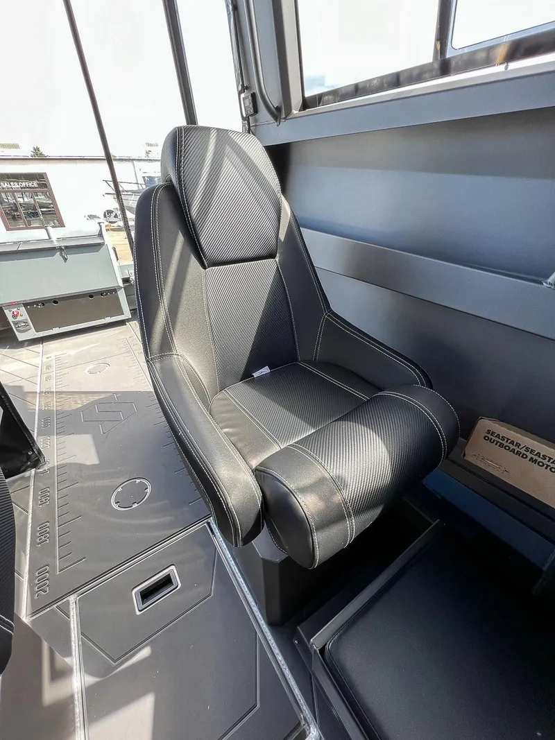 Slide: The Image of 2023 Stabicraft 2250 Ultra Centercab interior seat with black upholstery. - 10