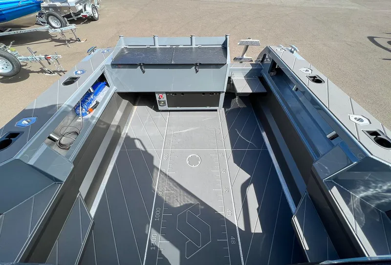 Slide: The Image of 2023 Stabicraft 2250 Ultra Centercab interior, featuring spacious deck and storage compartments. - 17