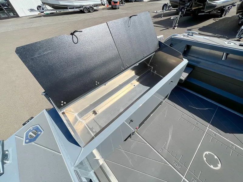 Slide: The Image of Open storage compartment on a 2023 Stabicraft 2250 Ultra Centercab boat. - 18
