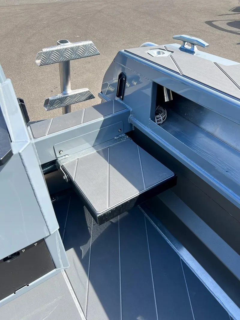 Slide: The Image of 2023 Stabicraft 2250 Ultra Centercab interior detail, featuring durable flooring and storage compartments. - 19