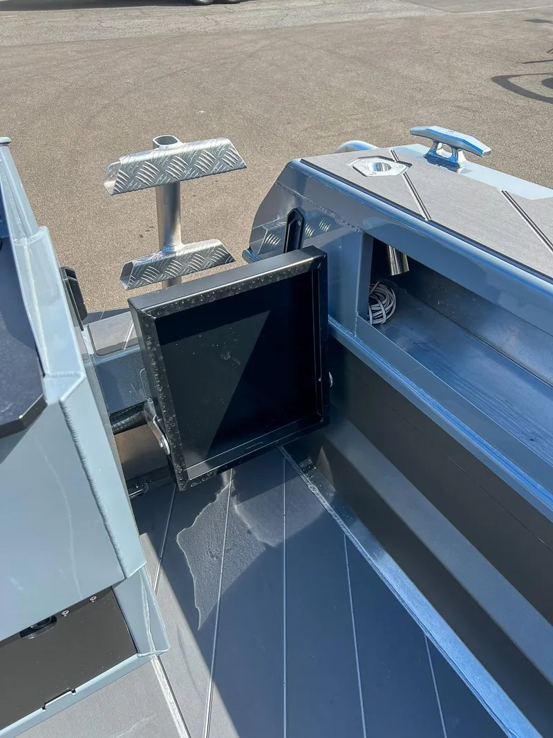 Slide: The Image of 2023 Stabicraft 2250 Ultra Centercab interior detail showing storage compartment and deck. - 20