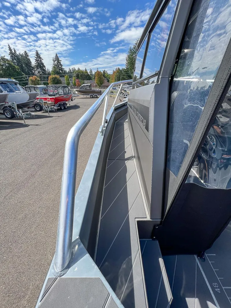 Slide: The Image of 2023 Stabicraft 2250 Ultra Centercab boat on display under a clear blue sky. - 22