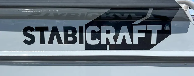 Slide: The Image of Stabicraft 2250 Ultra Centercab 2023 logo on boat exterior. - 28