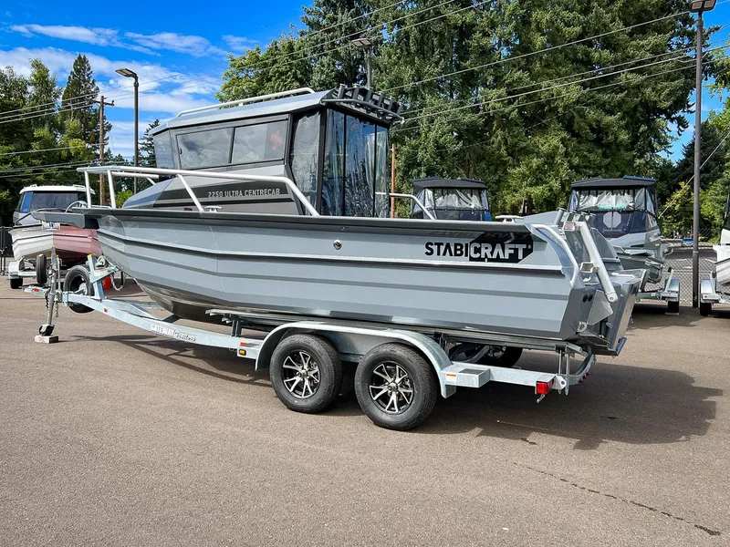 Slide: The Image of 2023 Stabicraft 2250 Ultra Centercab boat on a trailer in a parking lot. - 3