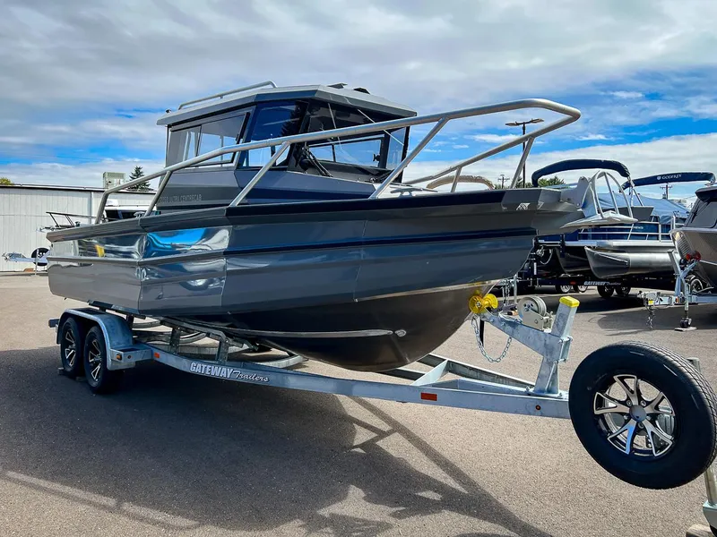 Slide: The Image of 2023 Stabicraft 2250 Ultra Centercab boat on a trailer in a parking lot. - 6