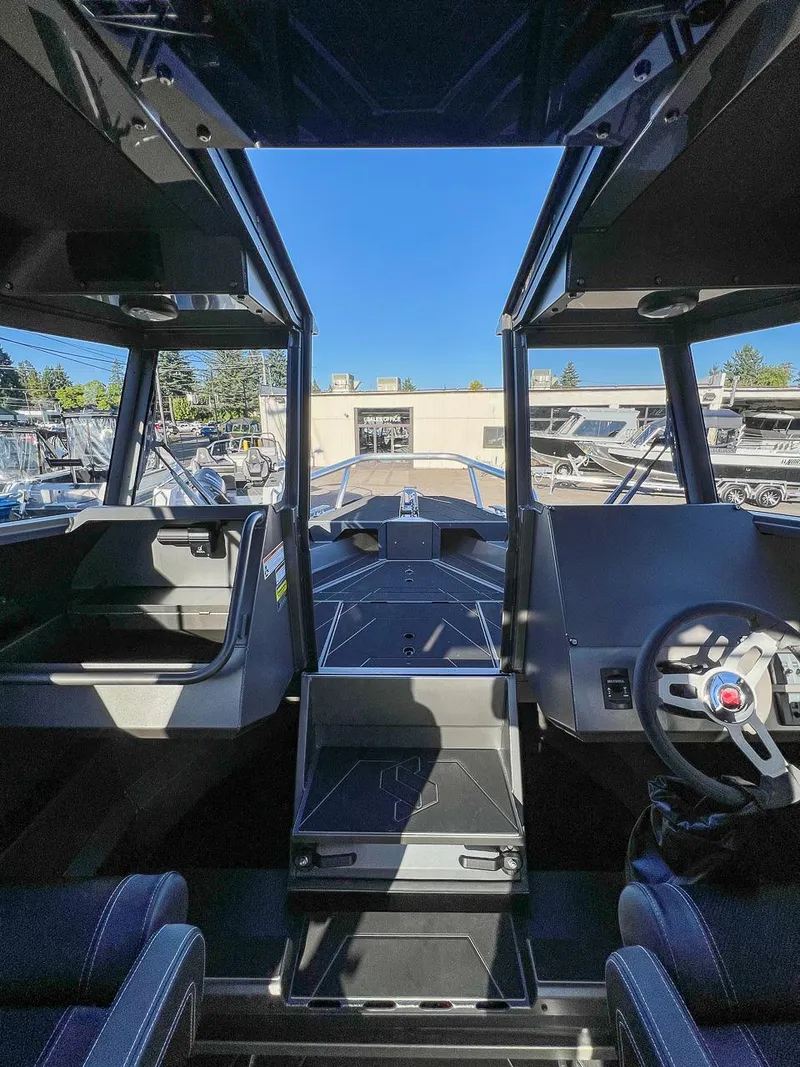 Slide: The Image of Interior view of 2023 Stabicraft 2250 UltraCab WT boat, showcasing helm and seating area. - 10
