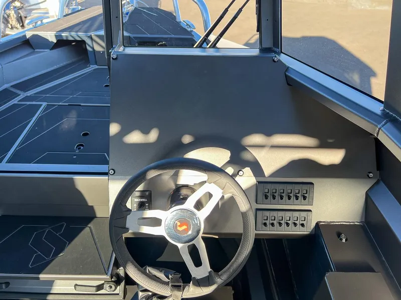 Slide: The Image of 2023 Stabicraft 2250 UltraCab WT helm with steering wheel and control panel. - 11