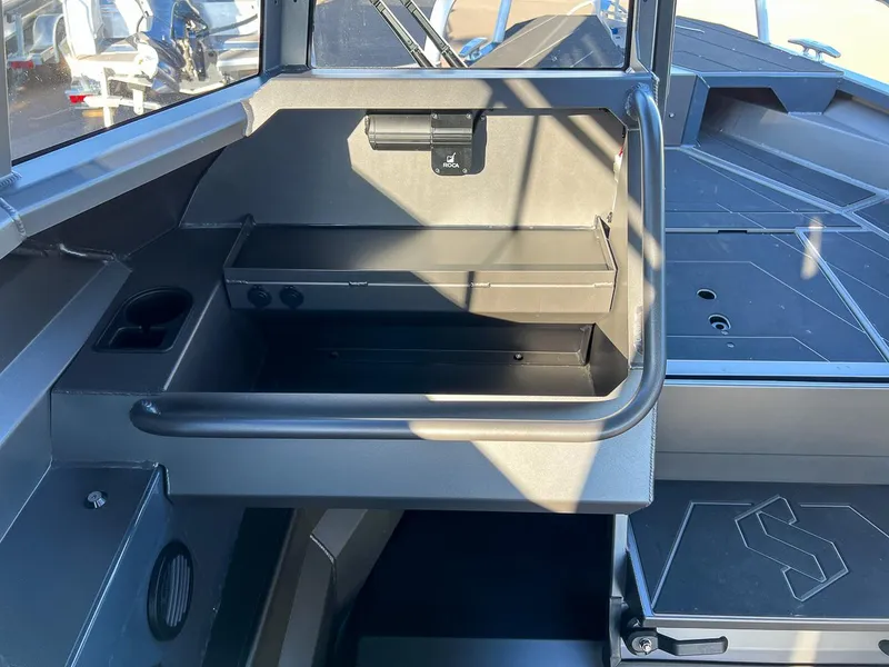 Slide: The Image of 2023 Stabicraft 2250 UltraCab WT interior storage compartment and deck. - 12