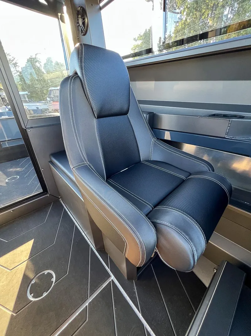 Slide: The Image of Captain's chair in 2023 Stabicraft 2250 UltraCab WT boat interior. - 15