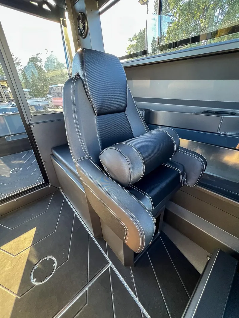 Slide: The Image of Captain's chair in 2023 Stabicraft 2250 UltraCab WT boat interior. - 16