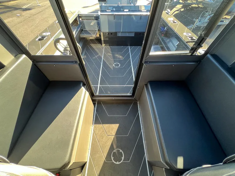 Slide: The Image of Interior of 2023 Stabicraft 2250 UltraCab WT, featuring seating and deck area. - 17
