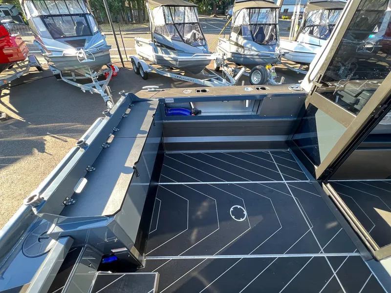 Slide: The Image of 2023 Stabicraft 2250 UltraCab WT interior, showcasing spacious deck and modern design. - 19