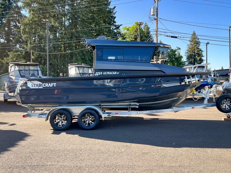 Slide: The Image of 2023 Stabicraft 2250 UltraCab WT boat on trailer in outdoor setting. - 2