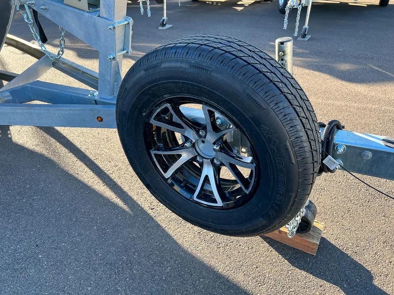 Slide: The Image of 2023 Stabicraft 2250 UltraCab WT trailer wheel and tire on asphalt. - 27