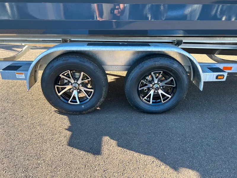 Slide: The Image of Close-up of 2023 Stabicraft 2250 UltraCab WT trailer wheels on asphalt. - 28